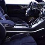 Modern car interior with front seats and dashboard