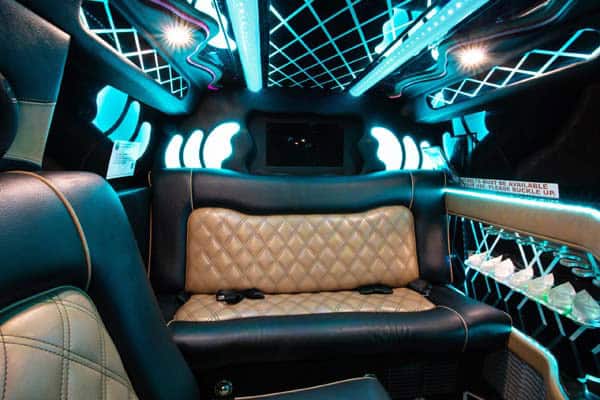 Luxury limousine interior with neon lights and leather seats