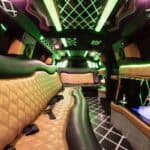 Luxury limousine interior with neon lights and bar