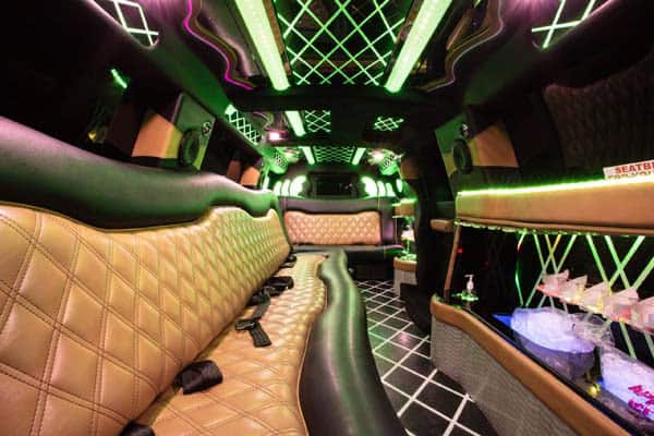Luxury limousine interior with neon lights and bar