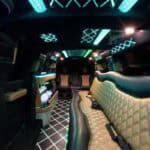 Luxury limousine interior with neon lighting and leather seats