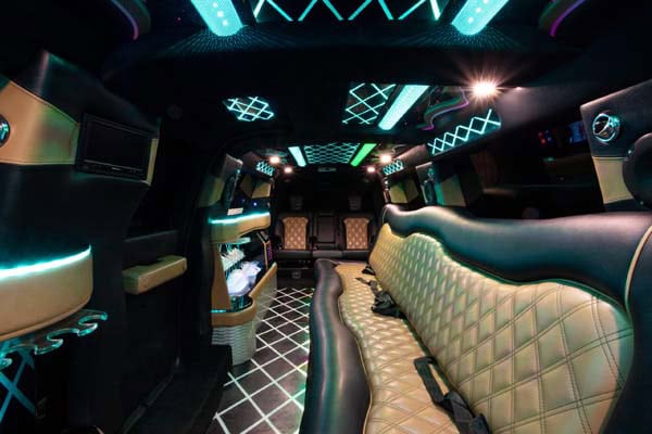 Luxury limousine interior with neon lighting and leather seats