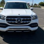 Front view of white Mercedes-Benz SUV parked.