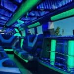 Neon-lit luxury limousine interior with leather seats