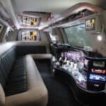 Luxury limousine interior with bar and leather seating