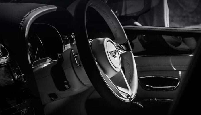 Luxury car interior with Bentley steering wheel