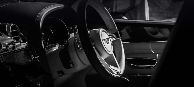 Luxury car interior with Bentley steering wheel