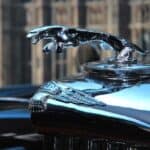 Chrome Jaguar hood ornament on classic car