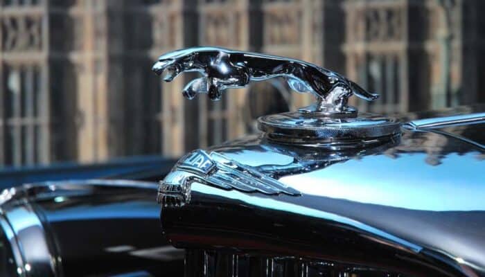 Chrome Jaguar hood ornament on classic car