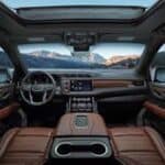 Luxury car interior with mountain lake view