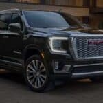 Black GMC SUV parked in residential driveway