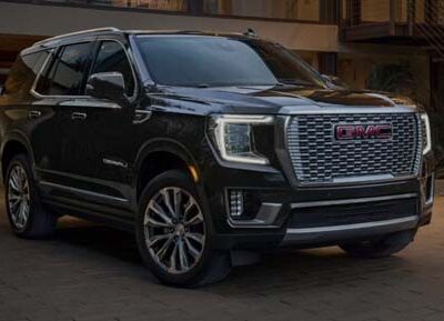 Black GMC SUV parked in residential driveway