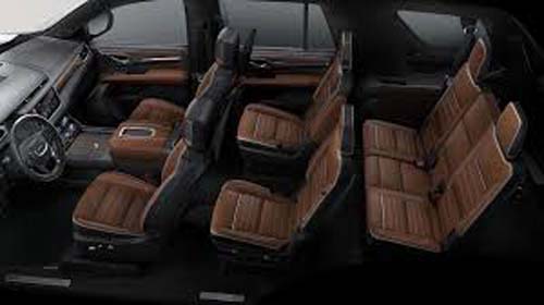 Three-row SUV interior with brown leather seats