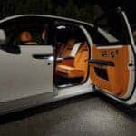 Luxury car with orange leather interior at night