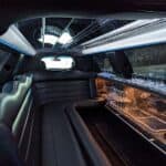 Luxury limousine interior with leather seats and bar