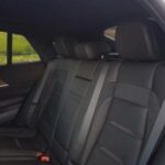 Black leather rear seats inside modern car interior