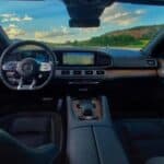 Luxury SUV interior with dashboard and countryside view