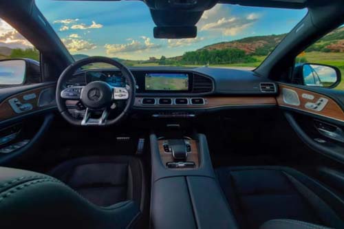 Luxury SUV interior with dashboard and countryside view