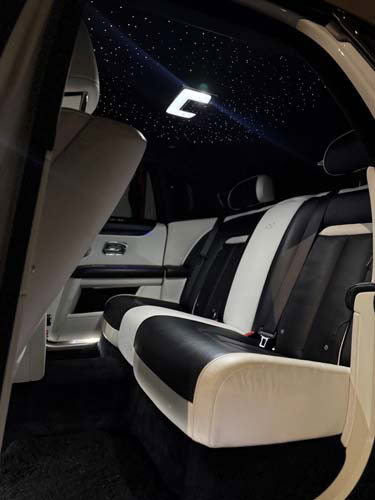 Luxury car interior with starry ceiling lights