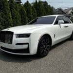 White Rolls-Royce sedan parked on residential street