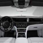 Luxury car interior with white leather and dashboard