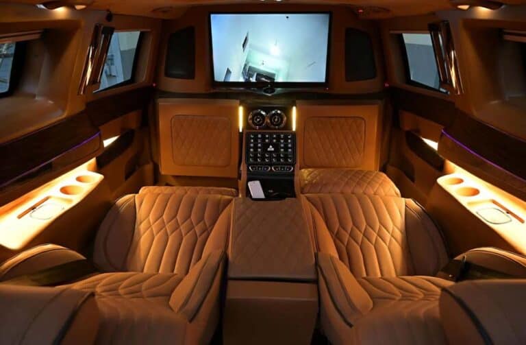 Luxury car rear cabin with leather seats and screen