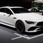 White Mercedes-Benz AMG four-door coupe on display