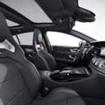 Modern car interior with leather seats and sunroof