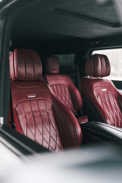 Luxurious red quilted leather car interior seats.