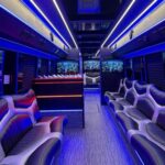 Luxurious party bus interior with blue lights and leather seats
