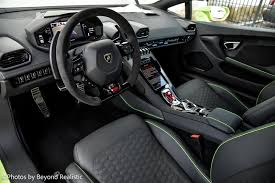 Lamborghini sports car interior with steering wheel and console