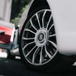 Close-up of Rolls-Royce wheel on white car