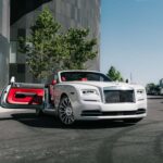 White Rolls-Royce convertible with red interior, door open