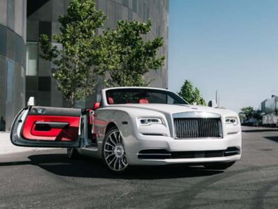 White Rolls-Royce convertible with red interior, door open