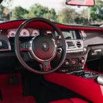 Luxury car interior with red leather and dashboard