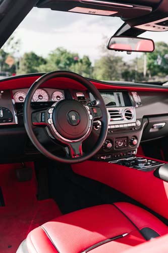 Luxury car interior with red leather and dashboard