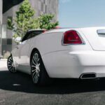 White luxury car parked near modern building