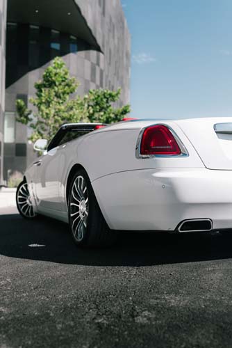 White luxury car parked near modern building