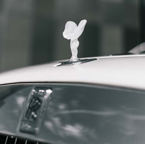 Rolls-Royce hood ornament on luxury car