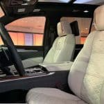 Luxury car interior with cream leather seats
