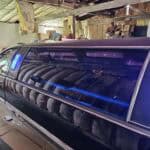 Black stretch limousine with blue interior lights indoors