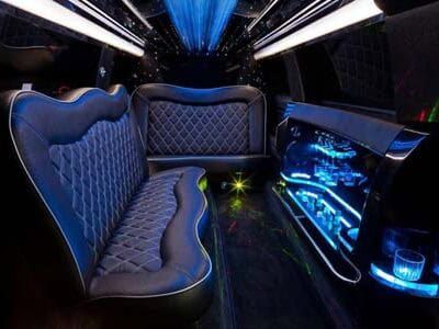 Luxury limousine interior with leather seats and neon lighting