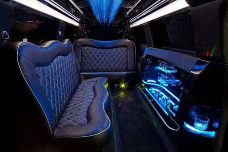 Luxury limousine interior with leather seats and neon lighting