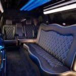 Luxury limousine interior with leather seats and blue lighting
