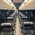 Empty passenger train car with black leather seats