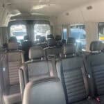 Interior of passenger van with black leather seats