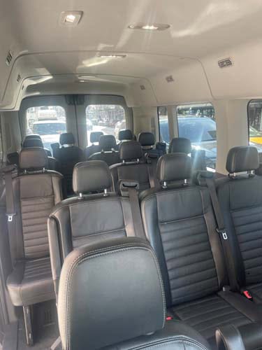Interior of passenger van with black leather seats