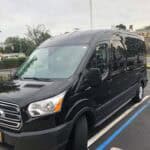 Black passenger van parked in accessible parking space