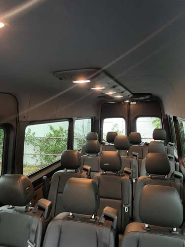 Interior of passenger van with multiple leather seats