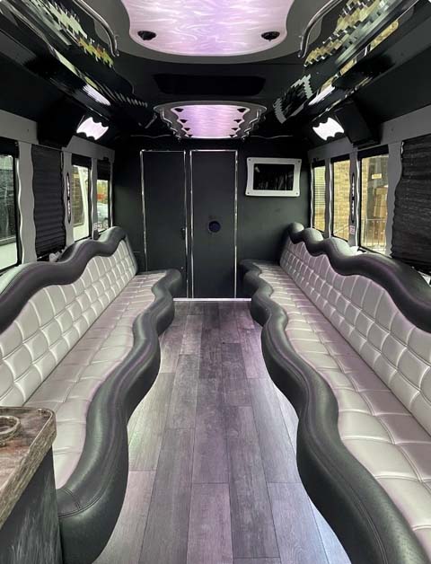 Interior of a luxury party bus with wavy leather seating